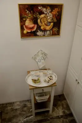 a small table with a plate of food on it at Classy and cozy near Tasmajdan park and Flower Piazza in Belgrade