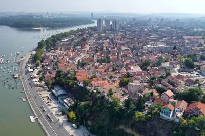an aerial view of a town next to a river at BRAND NEW Entire Place in CENTER of ZEMUN in Belgrade