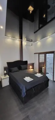 a bedroom with a large bed in a room at Bumerang Apartmans, New Belgrade, Belgrade Arena in Belgrade