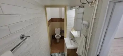 a small bathroom with a toilet and a sink at Bumerang Apartmans, New Belgrade, Belgrade Arena in Belgrade