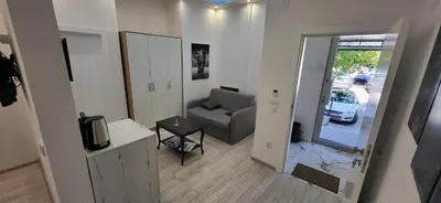 a living room with a couch and a television at Bumerang Apartmans, New Belgrade, Belgrade Arena in Belgrade