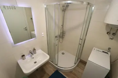 a bathroom with a shower and a sink at Savada Delta City - stan na dan Novi Beograd in Belgrade