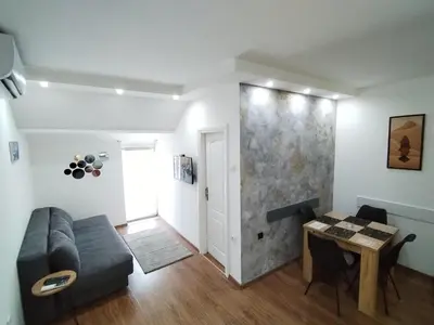 a living room with a couch and a table at Vidikovac in Belgrade