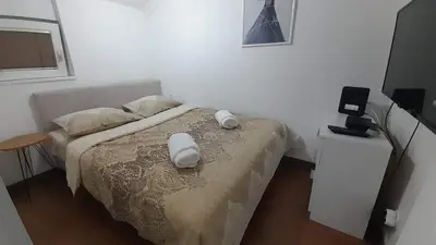 a bedroom with a bed with two towels on it at Vidikovac in Belgrade