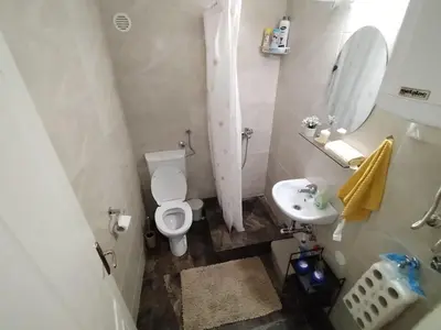 a small bathroom with a toilet and a sink at Vidikovac in Belgrade