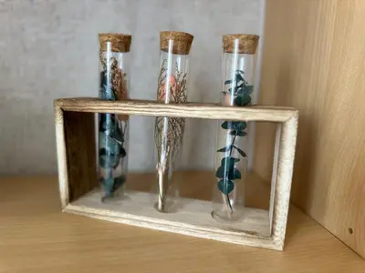 a shelf with four vases in a wooden frame at Angela apartment with 2 balconies in Belgrade