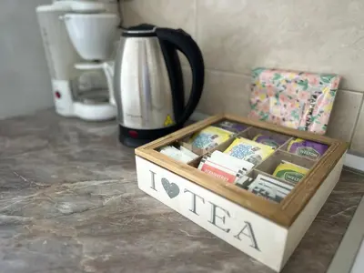 a wooden box filled with medicines on a counter at Angela apartment with 2 balconies in Belgrade