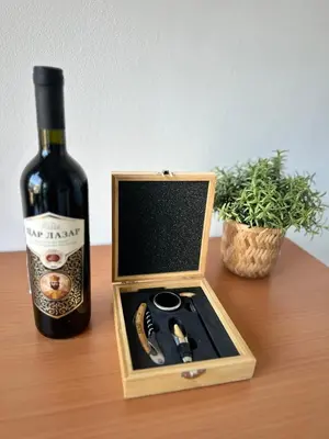 a bottle of wine sitting next to a bottle of champagne at Angela apartment with 2 balconies in Belgrade