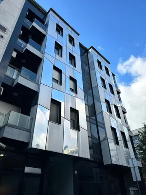 a tall building with a lot of windows at Angela apartment with 2 balconies in Belgrade