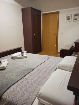 a hotel room with two beds with towels on them at BNB Apartments LUX in Belgrade