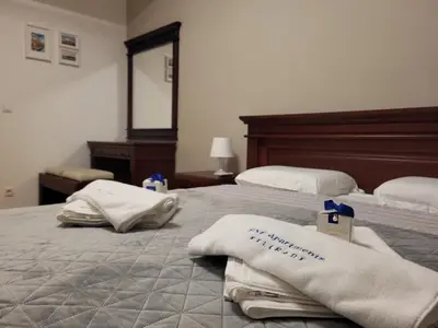 a hotel room with two beds with towels on them at BNB Apartments LUX in Belgrade