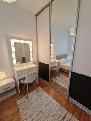 a room with a mirror and a bedroom with a bed at EMILY LUX Apartment Belgrade, Center in Belgrade