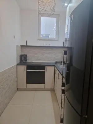 a small kitchen with a sink and a refrigerator at EMILY LUX Apartment Belgrade, Center in Belgrade