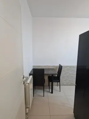 a dining room with a table and two chairs at EMILY LUX Apartment Belgrade, Center in Belgrade