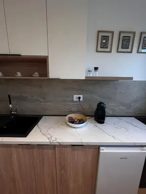 a bowl of food on a counter in a kitchen at Berenji Lux Apartment in Fontana