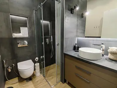 a bathroom with a shower and a toilet and a sink at Rajiceva for 4 one bdr one living room Knez Mihailova in Belgrade