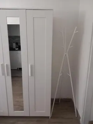 a wind turbine in a room with a mirror at Studio Djurdjica in Belgrade