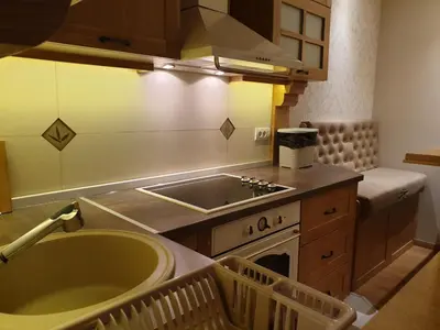 a kitchen with a sink and a stove top oven at Shabby Chik, cozy apartment near St Sava Temple in Belgrade