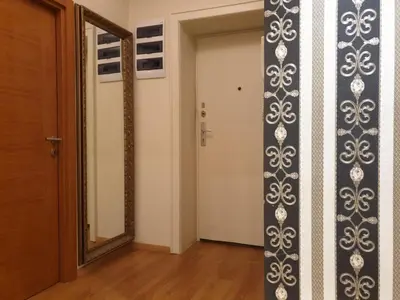a room with a door and a mirror and a hallway at Shabby Chik, cozy apartment near St Sava Temple in Belgrade