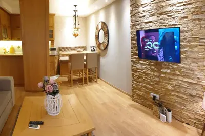 a living room with a couch and a table at Shabby Chik, cozy apartment near St Sava Temple in Belgrade