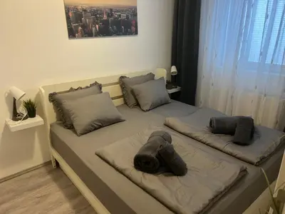a bedroom with a bed with an elephant head on it at Apartman Kutak in Belgrade