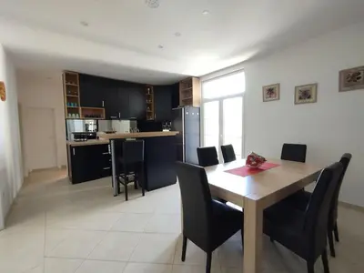 a dining room and kitchen with a table and chairs at 150sqm 3BDR Family apartment in central Belgrade in Belgrade