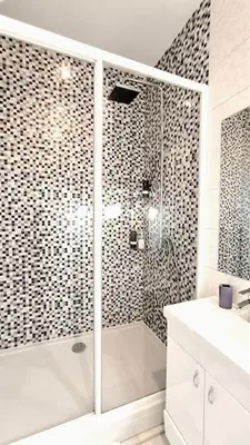 a white bathroom with a shower and a sink at 150sqm 3BDR Family apartment in central Belgrade in Belgrade