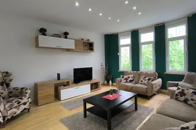 a living room with a couch and a tv at 150sqm 3BDR Family apartment in central Belgrade in Belgrade