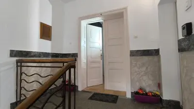 a hallway with a white door and a stair case at Spacious 3BDR Central apartment near Terazije & BW in Belgrade