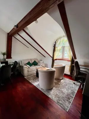 a living room with a couch and a table at Urban Oasis in Belgrade