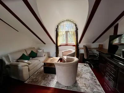a living room with a couch and a table at Urban Oasis in Belgrade