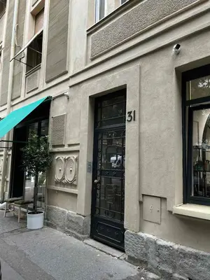 a building with a black door on a street at Urban Oasis in Belgrade