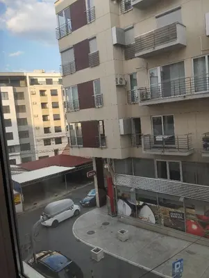 a car is parked in front of a building at Luna in Vračar (historical)