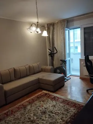 a living room with a couch and a window at Luna in Vračar (historical)