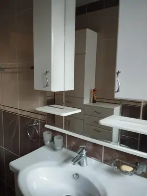 a bathroom with a white sink and a mirror at Luna in Vračar (historical)