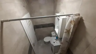 a small bathroom with a toilet and a sink at Udobna Dvokrevetna Soba Sa Terasom #2 in Mladenovac