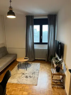 a living room with a couch and a table at Oasis Residences B in Belgrade
