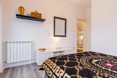 a bedroom with a bed and a mirror at Dorcol deluxe apartment in Belgrade