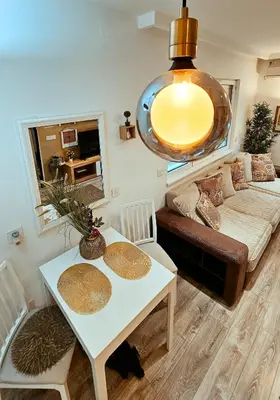 a living room with a table and a couch at Dorcol deluxe apartment in Belgrade