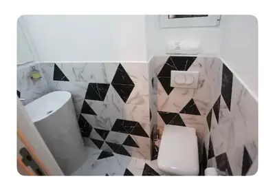 a bathroom with a white toilet and a sink at Luxury Apartment 8 in Belgrade