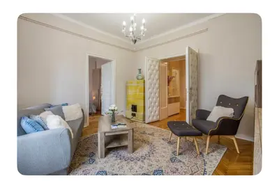 a living room with a couch and a table at Luxury Apartment 8 in Belgrade