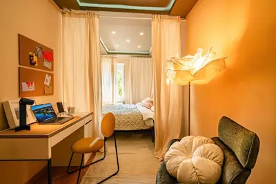 a room with a desk and a bedroom with a bed at Play Cloud with Cinema & Foosball Old Town Heart in Belgrade