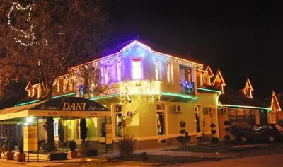 a building with christmas lights on top of it at Apartments DANI in Skorenovac