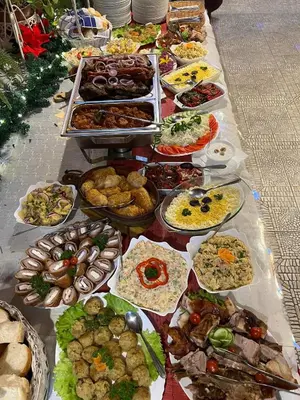 a table full of different types of food at Apartments DANI in Skorenovac