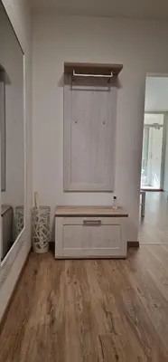 a room with a bench in the middle of a room at Sollemio in Novi Beograd