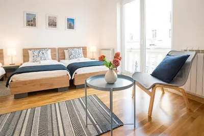 a bedroom with a bed and a table and a chair at 3 BDR for 6 CENTER CLOSE TO NATIONAL MUSEUM in Belgrade