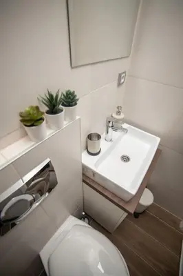 a small bathroom with a sink and a toilet at 3 BDR for 6 CENTER CLOSE TO NATIONAL MUSEUM in Belgrade