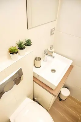 a bathroom with a sink and a toilet at 3 BDR for 6 CENTER CLOSE TO NATIONAL MUSEUM in Belgrade