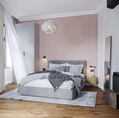 a bedroom with a bed and a chandelier at Mibu Apartments in Belgrade