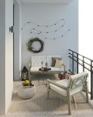 a living room with a white couch and a chair at Mibu Apartments in Belgrade